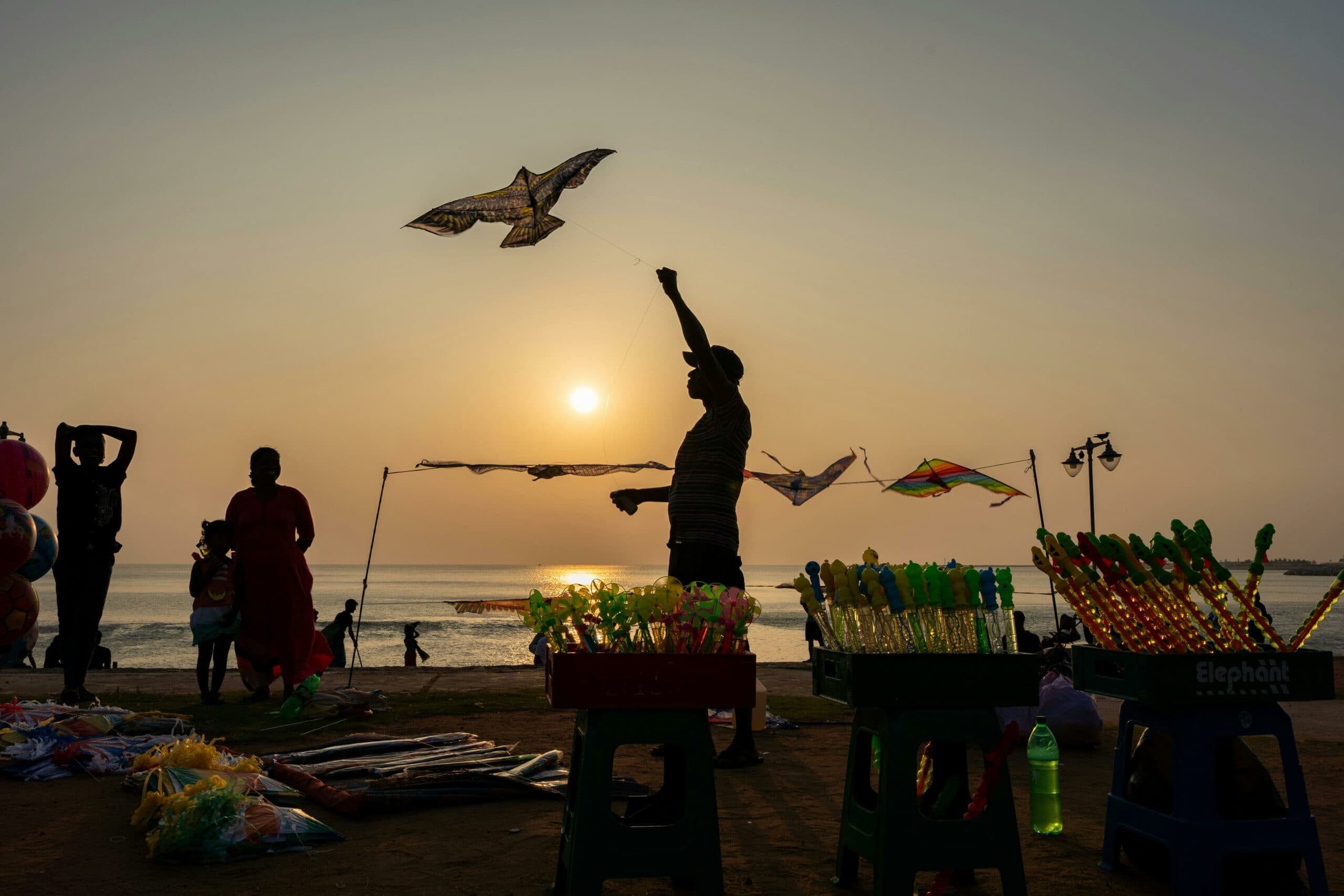 People enjoying the seaside in Colombo at sunset